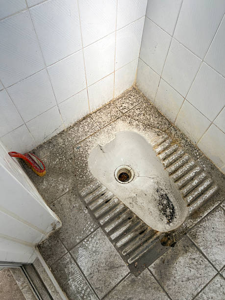 High angle view old and dirty squat toilet bowl with