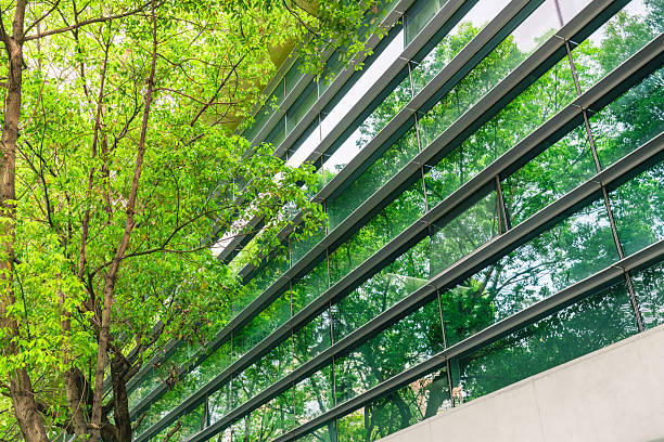 istock Business towers and Green leaves 2210605514