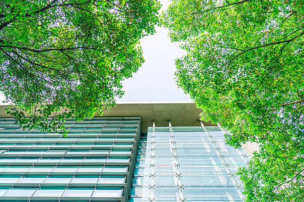 istock Business towers and Green leaves 2210605607