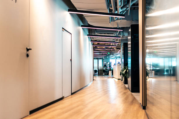 istock Modern office hallway with stylish lights and a bright professional atmosphere 2210605874