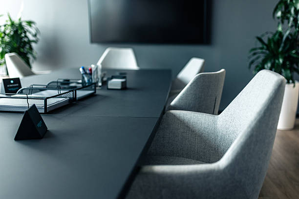Modern boardroom table set for a professional meeting with sleek decor