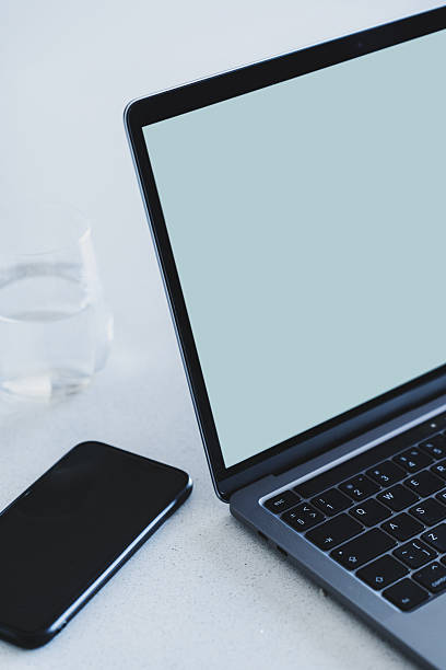 istock Close-up of a modern laptop with a blank light blue screen 2210608353