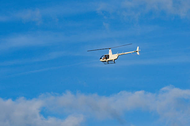 Miami, Florida - 4 January 20205: Robinson R-44 Raven II helicopter (registration N212WT) carring tourists on a sightseeing flight over the city of Miami.