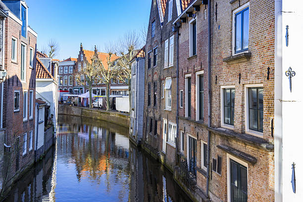 istock Old houses at the central canal in Oudewater 2210614523