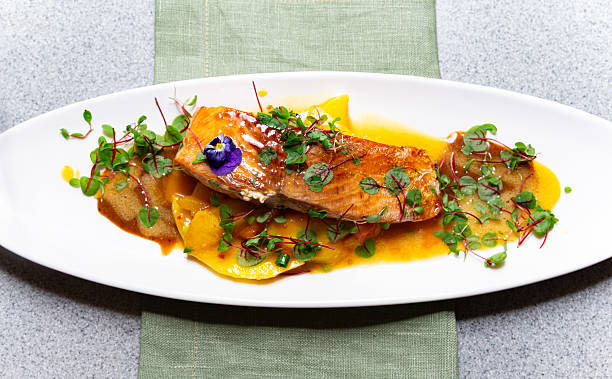 istock Gourmet salmon fillet with mango and microgreens. 2210615906