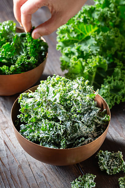 istock Homemade kale chips in copper bowl 2210617025