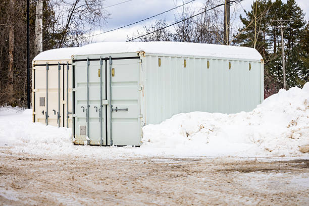 istock Snow-Covered Storage Containers During Winter in a Rural Landscape 2210621533