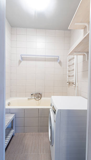 istock Minimalist Bathroom Interior With Bathtub, Sink, and Modern Design 2210621953