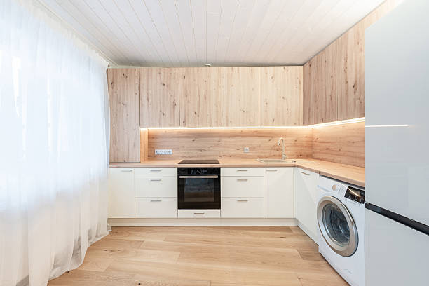 istock Modern Home Kitchen Interior With Wooden Cabinets and Natural Light Through Curtains 2210622182