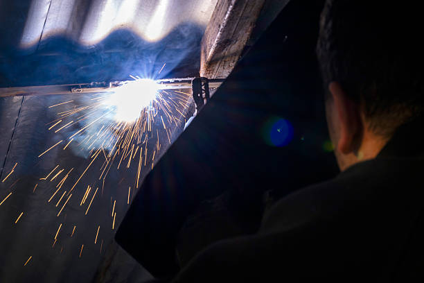 istock Young man does a house works with a welding machine 2210623340