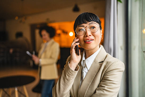 istock Japanese businesswoman use mobile phone for talk on work 2210624817