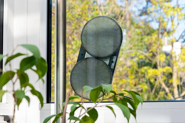 The robotic window cleaner works on a glass surface.