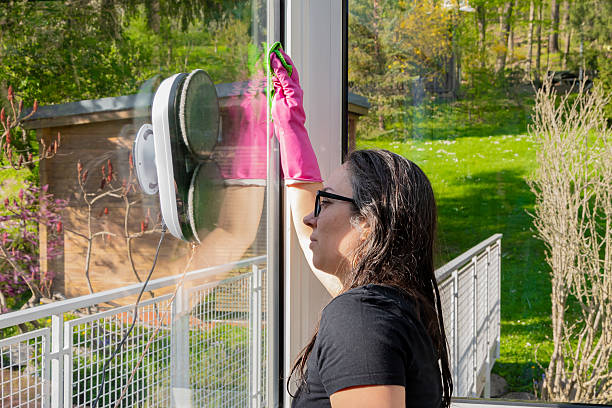 istock Home window cleaning with modern technology and manual labour. 2210625967