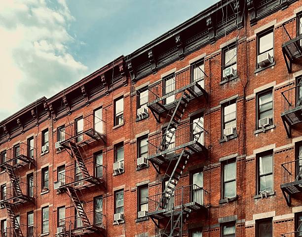 Brick apartment building with fire escapes