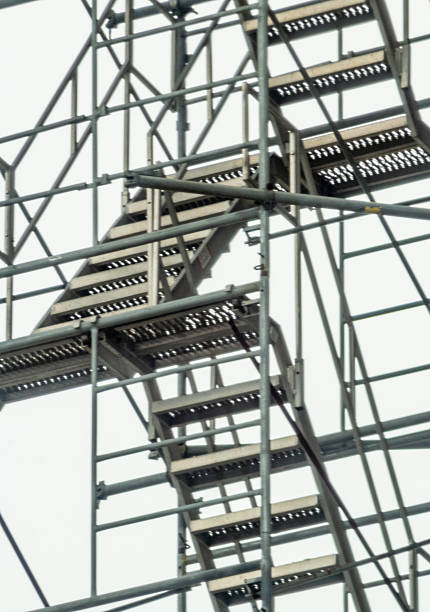 istock Industrial Metal Staircase Framed by Complex Steel Construction Elements 2210626317