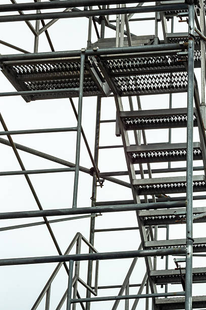istock Metal Staircase Structure Against a Clear Sky in Industrial Setting 2210626331