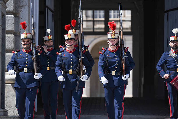 Paris, France - March 31, 2025: La Garde Républicaine marching down Quai de la Tournelle in the 5th arrondissement; it is an elite unit of the national gendarmerie (military police), serving as security patrols in Paris and honor guards for government officials.