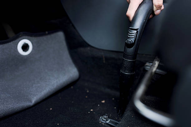 istock Handheld Vacuum Cleaner Detailing a Vehicle Interior with Precision and Care 2210628749