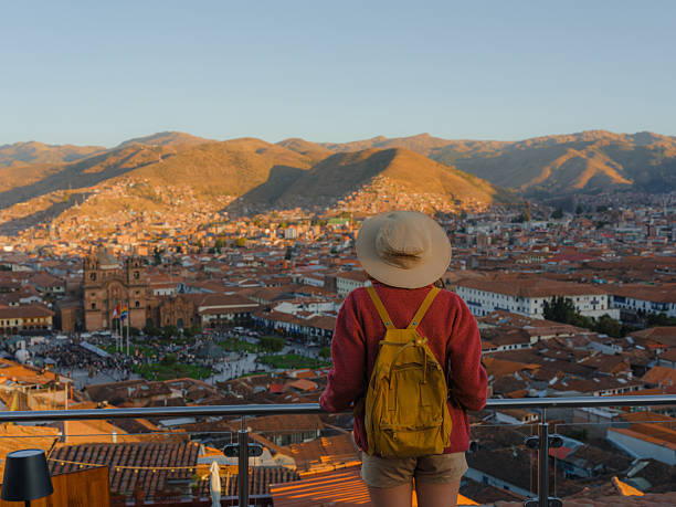 istock Cheerful adventurous woman exploring colonial architecture in Cusco Old town, Peru 2210630904