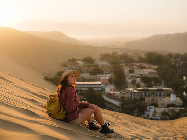 istock Woman exploring Huacachina oasis during trip to Peru 2210630925