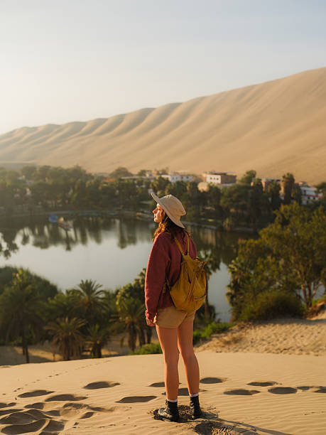istock Woman exploring Huacachina oasis during trip to Peru 2210630939