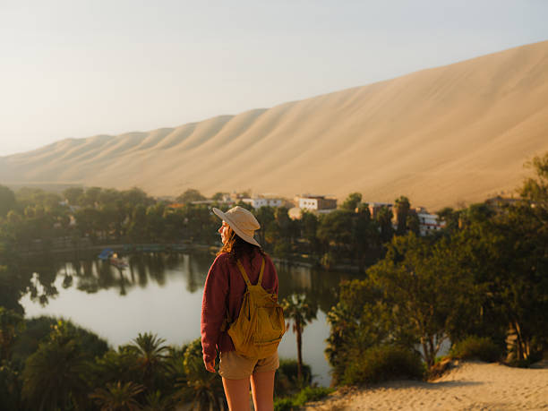 istock Woman exploring Huacachina oasis during trip to Peru 2210630946