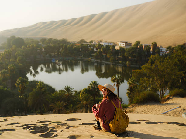 istock Woman exploring Huacachina oasis during trip to Peru 2210630947