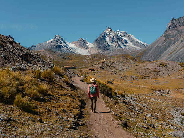 Determined man hiking in Andes in Cusco region during experiential trip to Peru