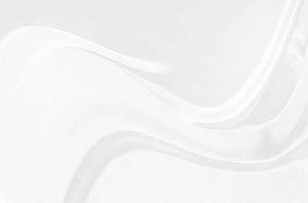 istock White gray satin texture that is white silver fabric silk background with beautiful soft blur pattern natural. 2210633406