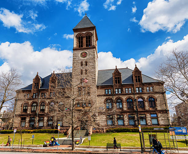 Spring flowers at the train depot with blue sky and clouds