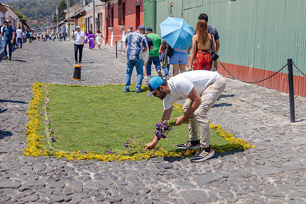 Artisans carefully create a colorful floral carpet by hand. A traditional decoration made of fresh petals, symbolizing celebration and devotion.