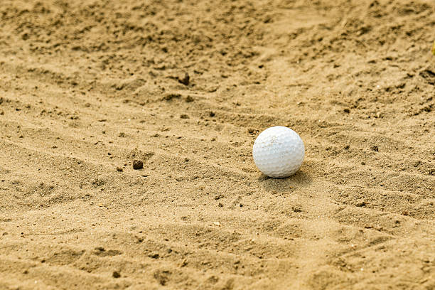 istock golf ball in a sand trap 2210638003