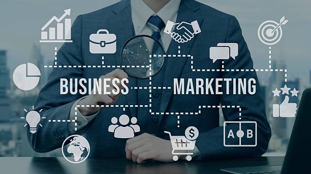 Businessman doing marketing research with a magnifying glass stock photo