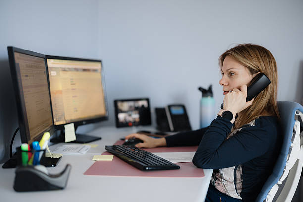 istock Professional Woman Working Remotely in a Modern Home Office Environment 2210642996