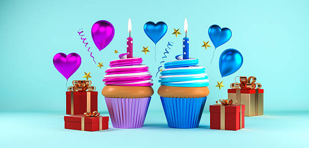 Birthday cupcake.Pastel yellow birthday cupcake with candle and blurred balloons.colorful birthday cupcake with a colored candle.Closeup,copy space.Birthday concept.