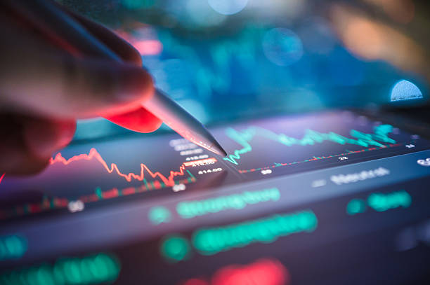 istock Millennial and Gen Z investor adjusting machine learning algorithms on a tablet device  in ai development using modern tools to making the best investment portfolio 2210645043