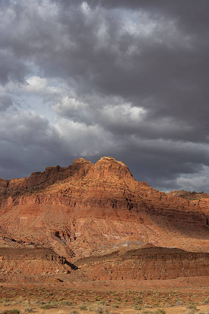istock Majestic red rock formations under an expansive cloudy sky in a desert landscape during late afternoon 2210645890