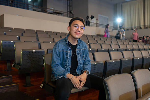 istock Young Asian Chinese Musician Relaxing Backstage Before Performance 2210646538