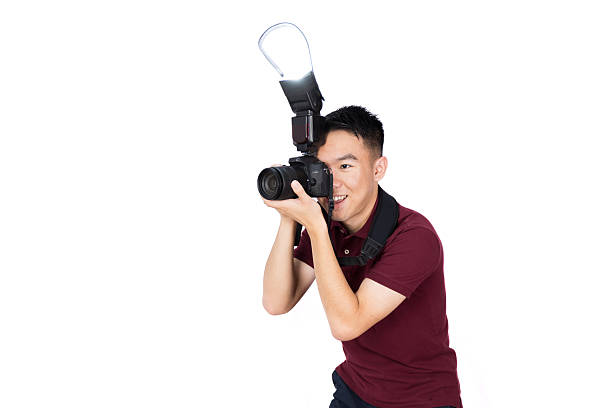 istock Photographer taking a photo with flash firing 2210647896
