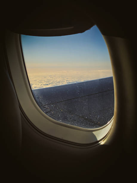 istock horizon and sunlight view out of an airplane window with partial interior surface background 2210651782