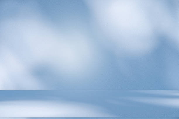 istock Studio style background wall decoration presentation uses white and blue tones. with shadows cast from a nearby window, concept creating a decorative 2210652788