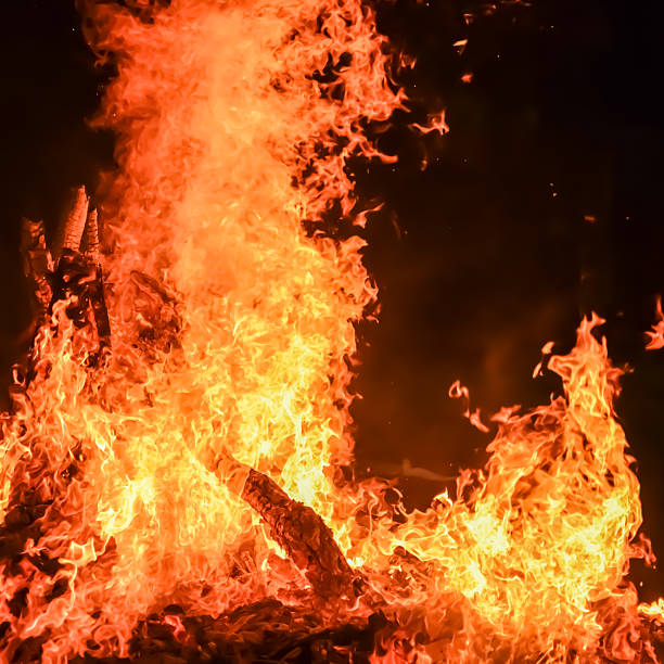 istock Fire flames on black background, Blaze fire flame texture background, Beautifully, the fire is burning, Fire flames with wood and cow dung bonfire 2210653057