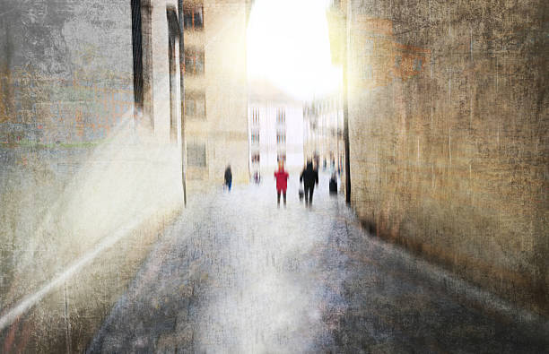 istock Blurry walking people in the old town 2210655001