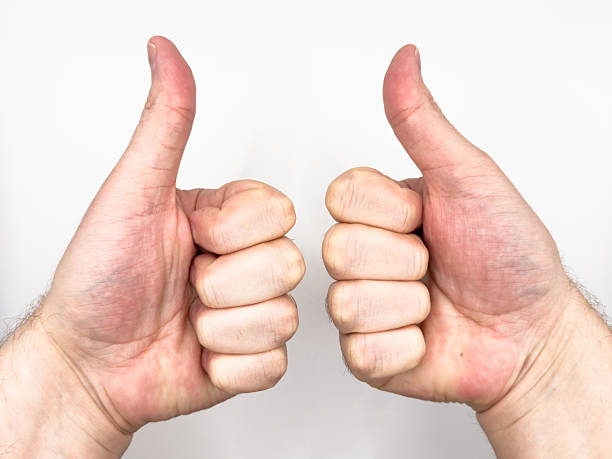 istock White male hand showing thumb up with two hands left and right on white background image 2210657778