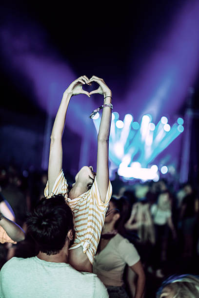 istock Sharing some love on music festival! 2210659930