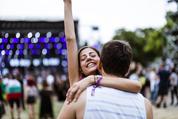 istock Embraced couple having fun on music concert. 2210660802