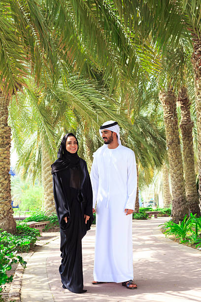 istock Middle Eastern couple walking in the park 2210661481