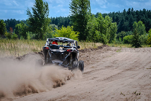 istock UTV buggy, ATV (quad), 4x4 in the action on sand 2210662491