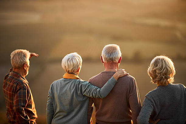 istock Back view of seniors looking at view from a hill. 2210662832