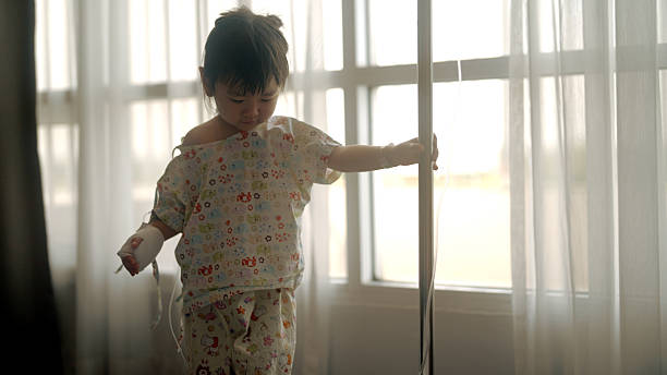 istock Young Asian girl is sick in bed 2210663176